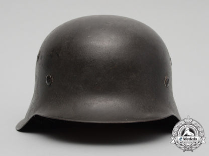 an_outstanding_m42_waffen-_ss_combat_helmet_with_single_c.a._pocher_reverse_decal_d_1967