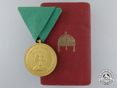 A Hungarian Bronze Merit Medal With Case