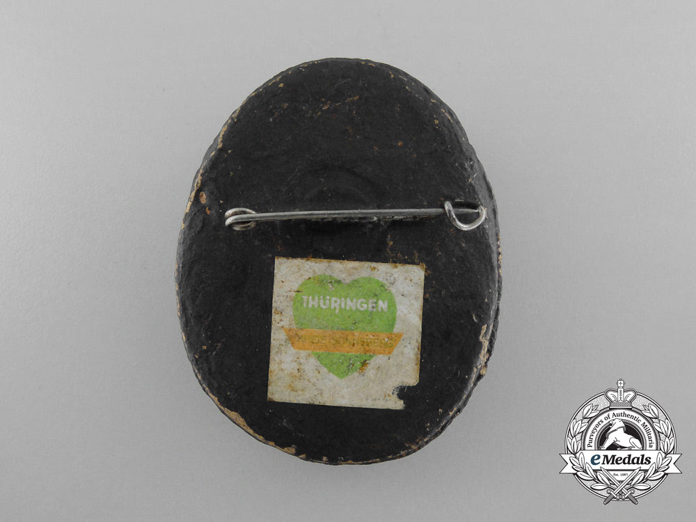 a_unique1934-1935_winterhilfswerk_badge_d_8447