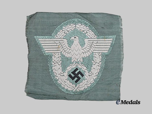 germany,_ordnungspolizei._a_schutzpolizei_sleeve_eagle_for_enlisted_ranks,_wartime_be_vo_variant_e_medals__g62174_2