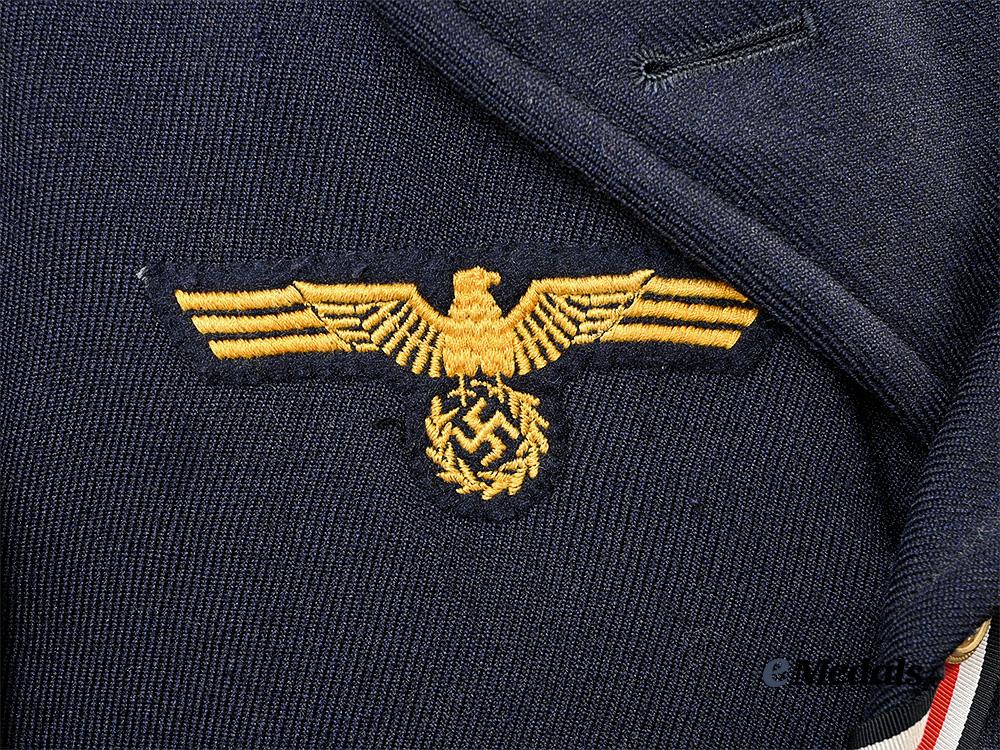 germany,_kriegsmarine._a_dark_blue_service_jacket_for_a_torpedo_mechanic_gefreiter_e_medals__g63219_11