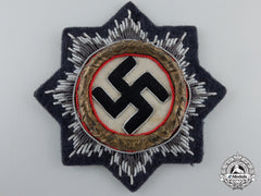 A Luftwaffe Issue German Cross In Gold; Cloth Version