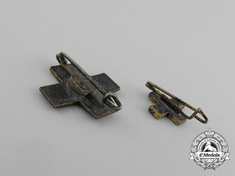 a_grouping_of_two_drk(_deutsches_rotes_kreuz)_badges_e_6483