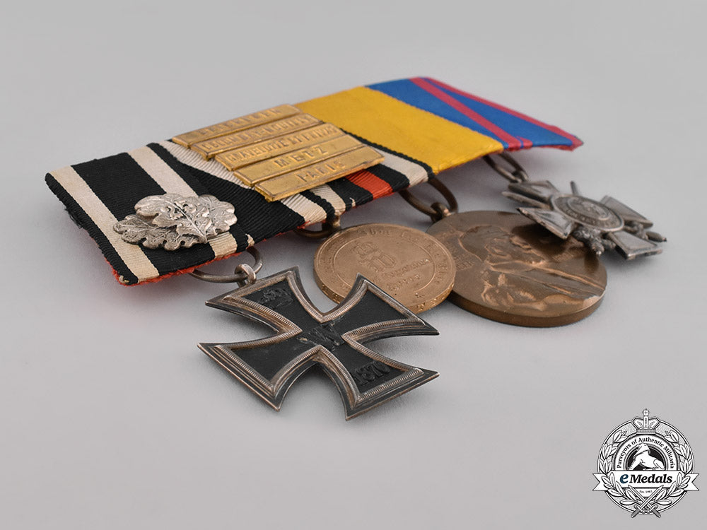 prussia,_state._a_four_piece_medal_bar_with_an_iron_cross_jubilee_oakleaf_and_campaign_bars_emd_2109_1