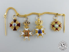 An Exquisite Miniature Grouping In Gold