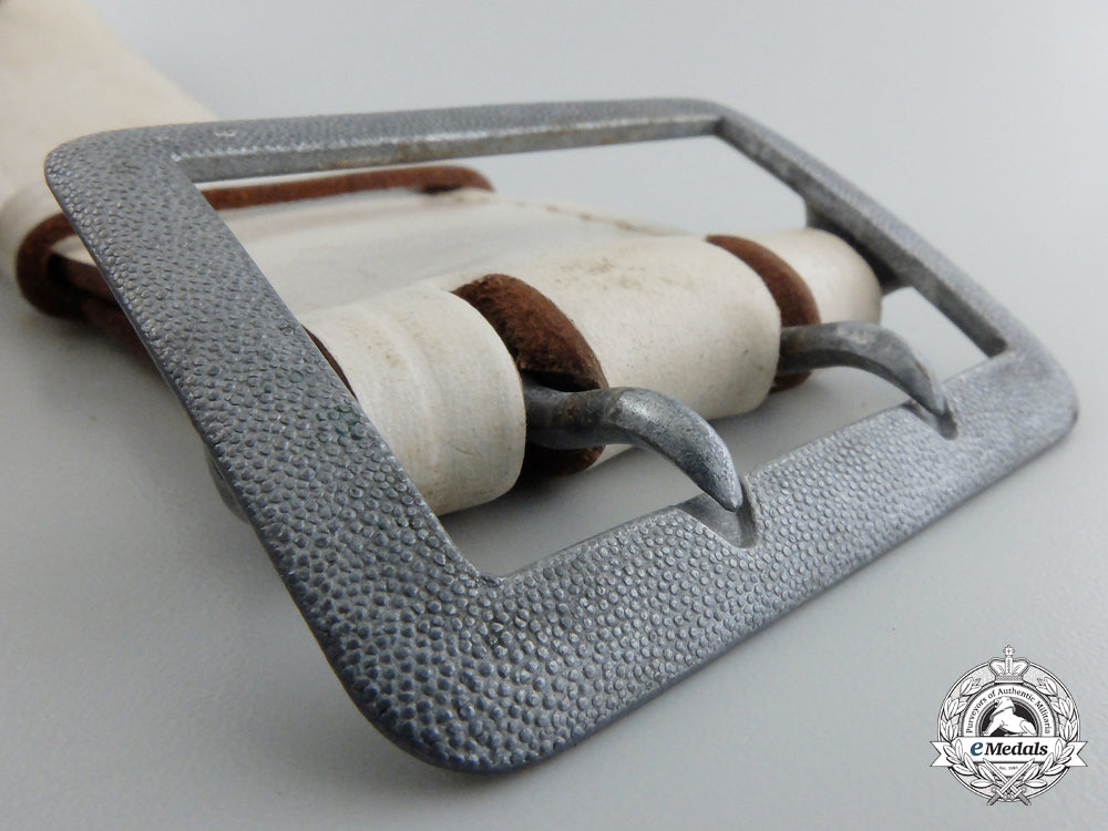 an_unattributed_white_belt_with_open-_claw_buckle&_should_strap;_published_g_707