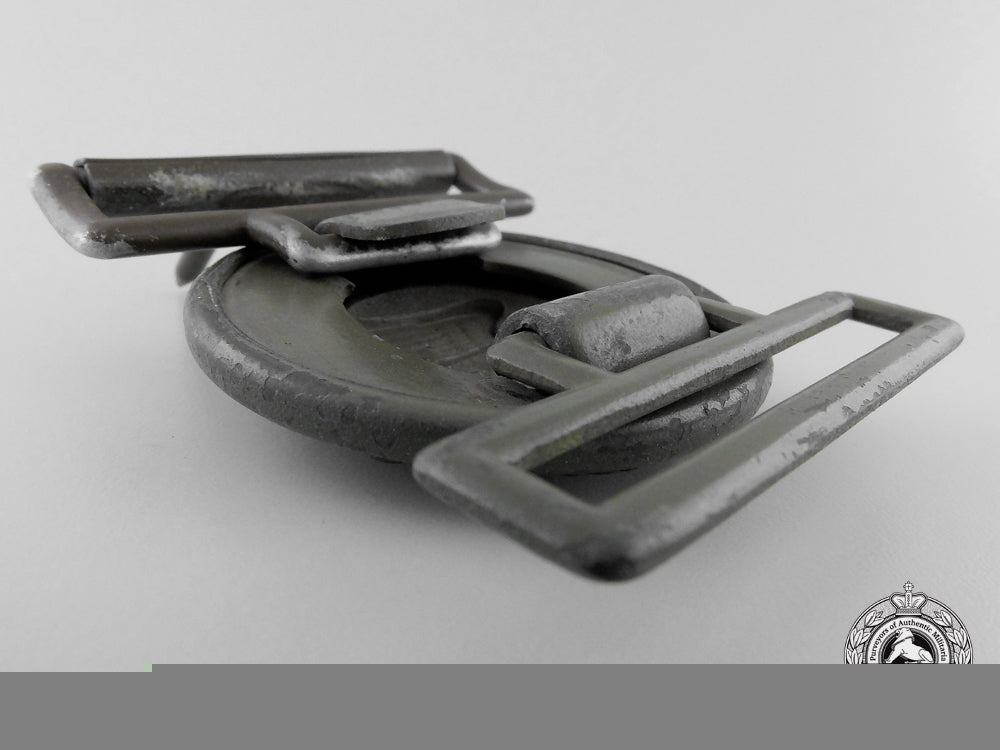 a_tropical_army_officer's_belt_buckle;_published_example_h_924