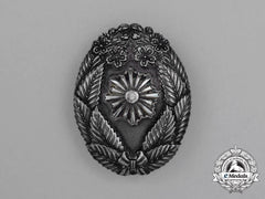 Japan, Imperial. A Fire Brigade Merit Badge In Silver