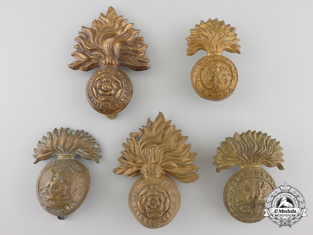 four_first&_second_war_british_fusilier_cap_badges_and_one_collar_tab_img_01_27_21