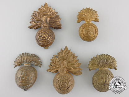 four_first&_second_war_british_fusilier_cap_badges_and_one_collar_tab_img_01_27_21