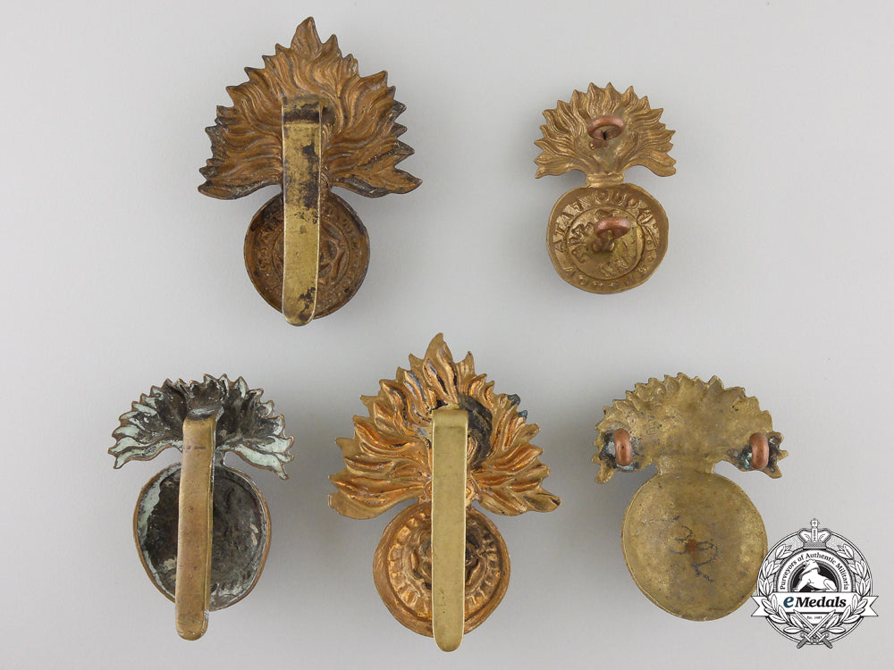 four_first&_second_war_british_fusilier_cap_badges_and_one_collar_tab_img_02_25_21