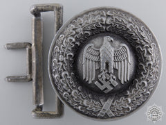 An Officer’s Buckle With Tropical Belt