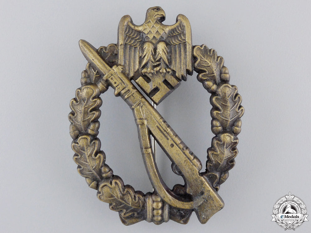 a_mint_bronze_grade_infantry_badge_with_packet_of_issue_by_jfs_img_02.jpg559e920a43dd6