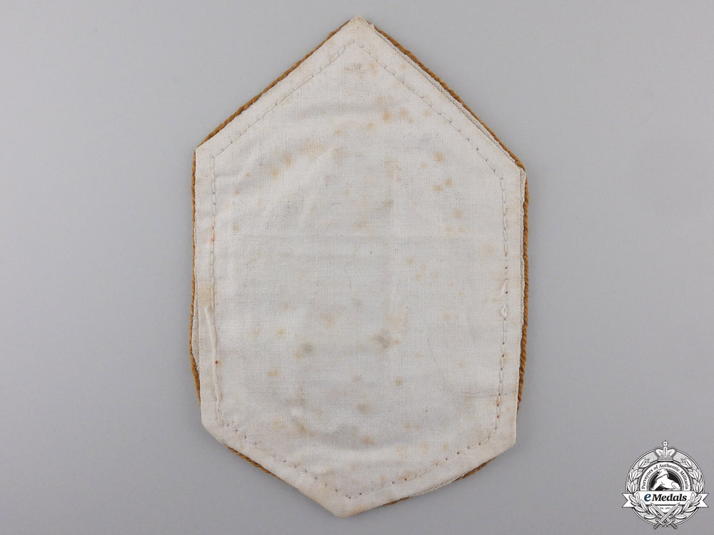 italy._a_large_fascist_cloth_badge,_c.1940_img_02.jpg5543bb8eca8cf