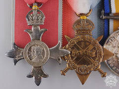 An Mbe & Long Service Medal Bar To Lieutenant Arthur R. Hughes