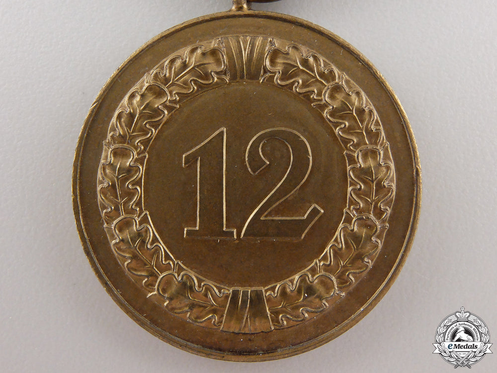 a_wehrmacht_long_service_medal;12_years_service_img_03.jpg55478797774d7