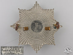 A First War Royal Canadian Regiment Cap Badge