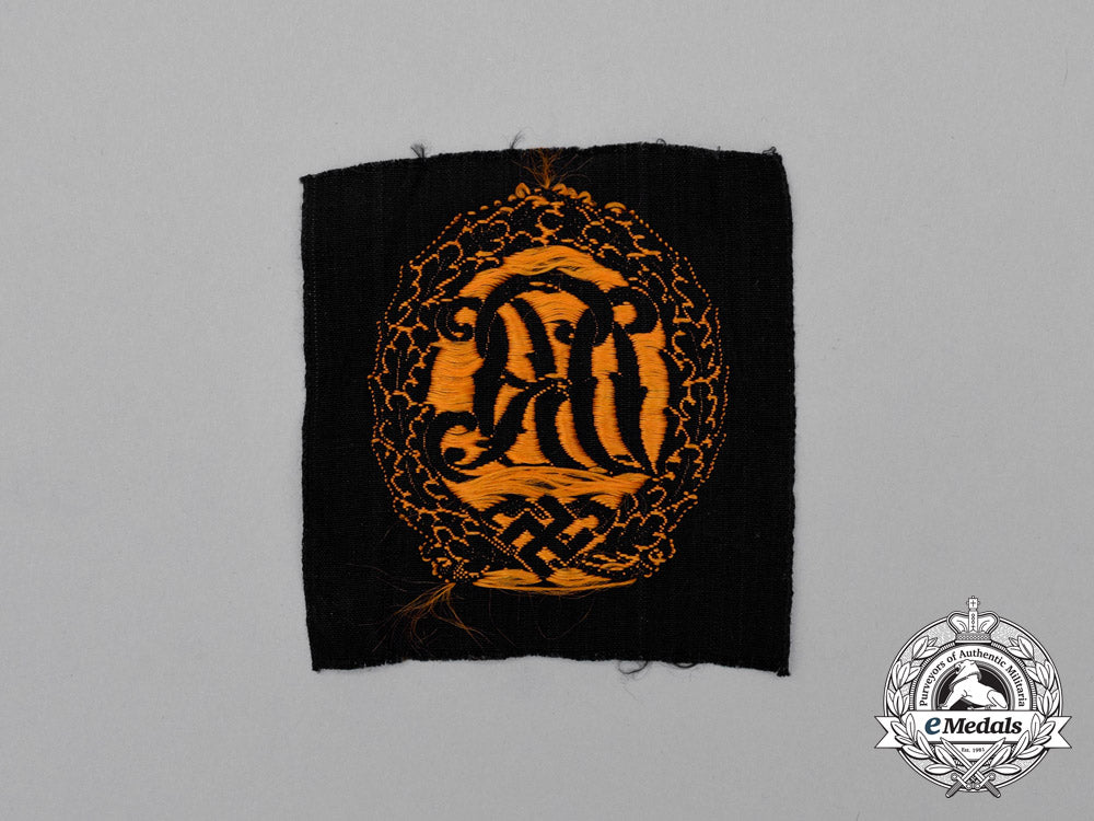 a_mint_and_unissued_third_reich_period_gold_grade_drl_badge;_cloth_version_j_123_1