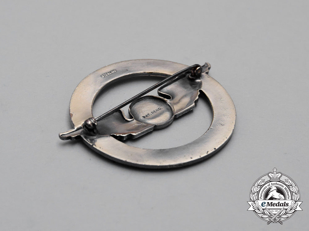 a_civil_aeronautics_administration(_caa)_war_training_service_cap_badge_j_268_1