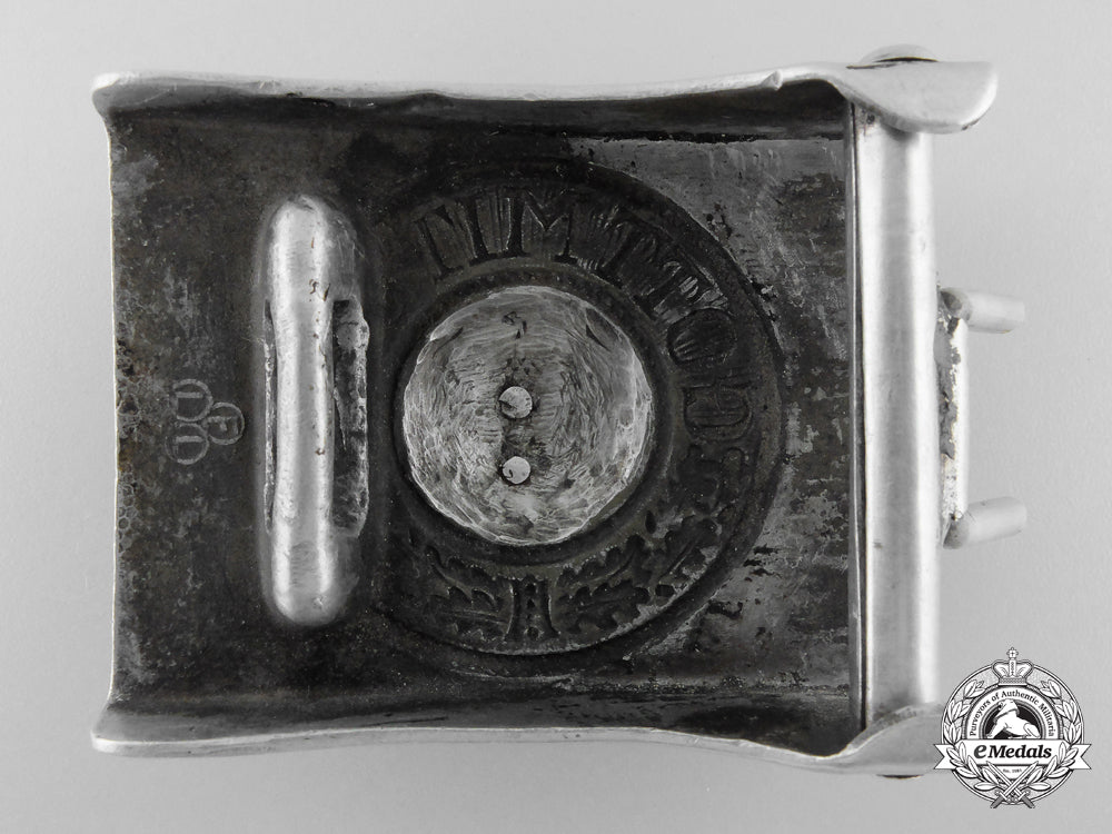 a_unique_army_em_belt_buckle_with_civil_police_insignia_added_buckle;_published_j_536