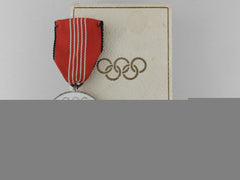 A Xi Summer Olympic Games Medal With Case