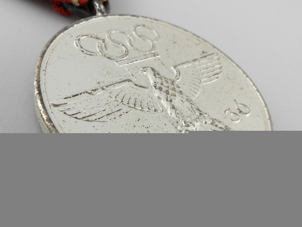 a_xi_summer_olympic_games_medal_with_case_k_019