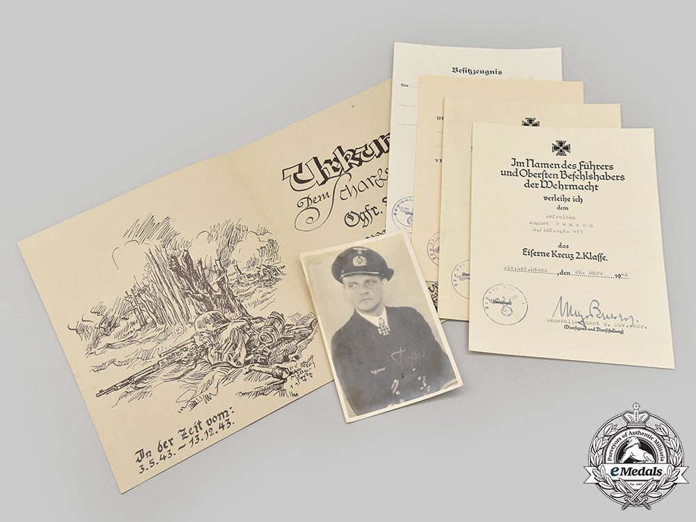 germany,_heer._a_rare_camouflage_smock_and_award_documents_to_sniper_obergefreiter_august_pamann,33_confirmed_kills_l22_mnc0300_175_1