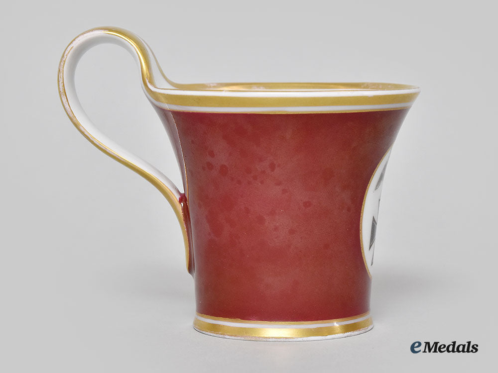 germany,_imperial._a_red_glazed_porcelain_iron_cross_mug,_by_furstenberg_l22_mnc9151_392_1