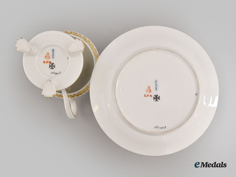 germany,_imperial._a_grey_glazed_clawfoot_iron_cross_motif_teacup_set,_by_kpm_l22_mnc9399_603_1