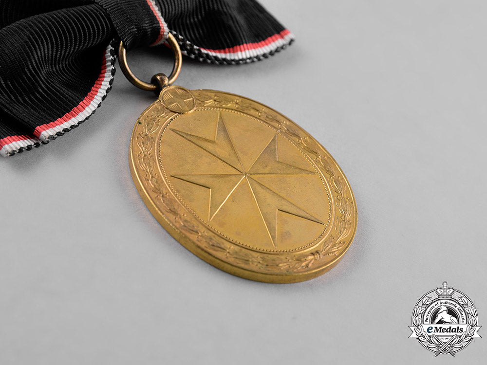 austria,_empire._an_order_of_the_knights_of_malta_gold_merit_medal,_c.1918,_with_wd_ribbon_m18_9891