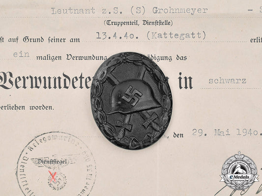 germany,_kriegsmarine._a_black_grade_wound_badge_with_document,_to_leutnant_zur_see_s._grohnmeyer_m20_2915_mnc8960