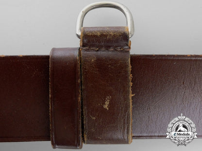a_brown_forestry_belt_with_single_open_claw_buckle_o_935_1