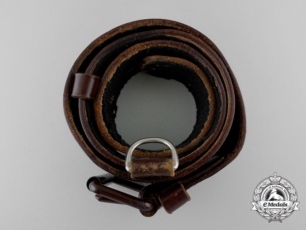 a_brown_forestry_belt_with_single_open_claw_buckle_o_937_1