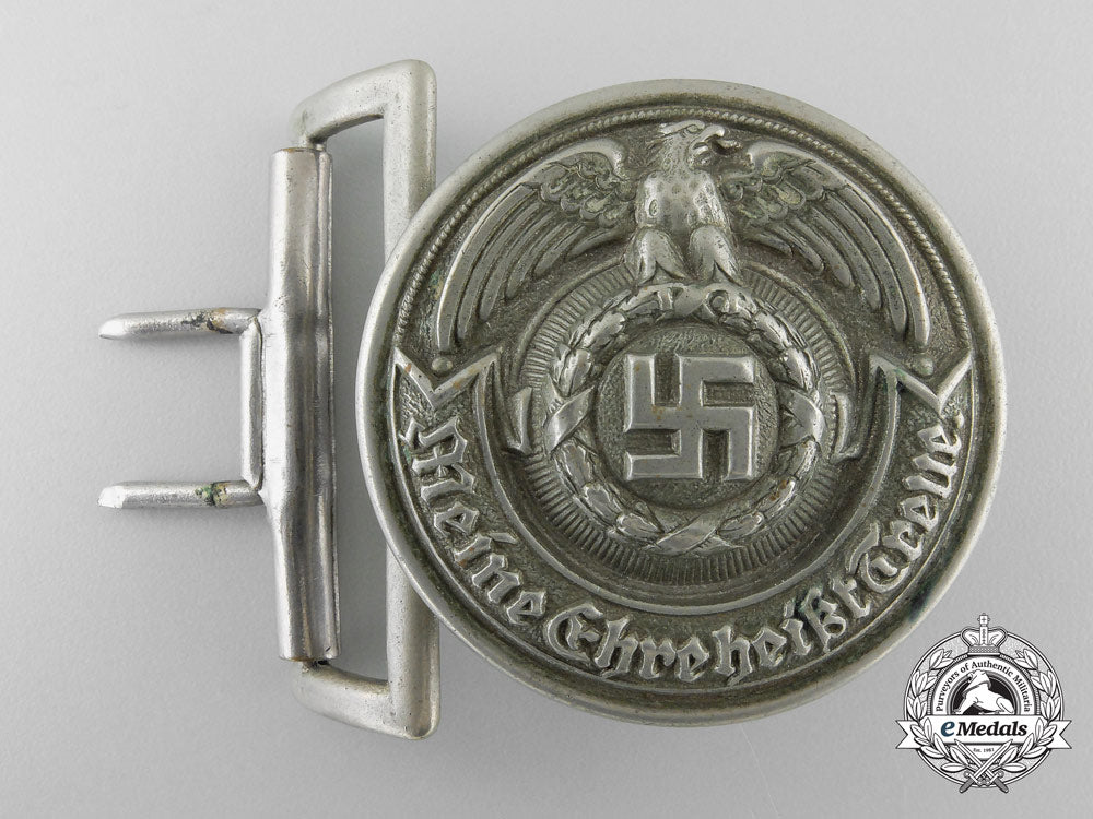 an_early&_rare_ss-_officer’s_belt_buckle_in_nickel-_silver_by_overhoff&_cie;_published_example_p_083