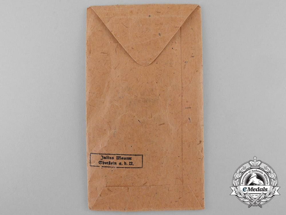 a_german_east_medal_with_packet_of_issue_by_julius_maurer_oberstein_x_371