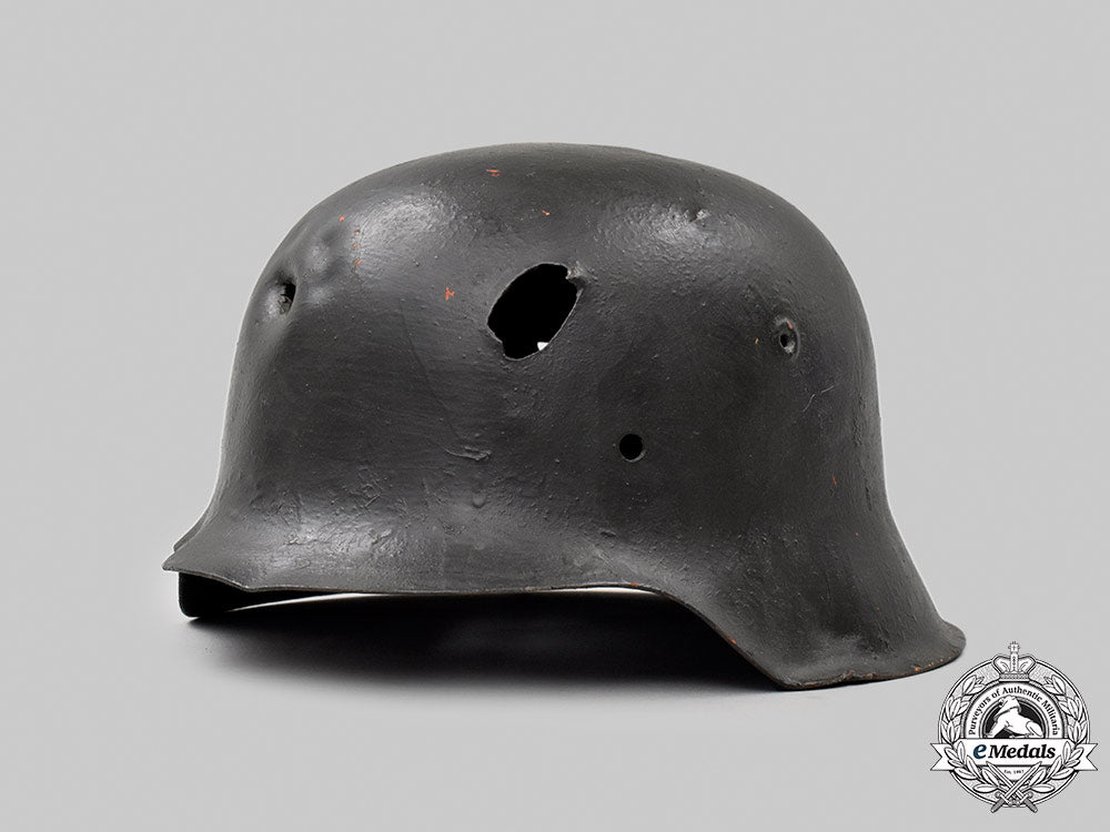 germany,_heer._a_battle-_damaged_m42_stahlhelm_049_m21_mnc9368-copy_1