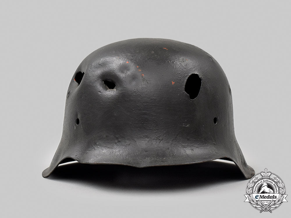 germany,_heer._a_battle-_damaged_m42_stahlhelm_050_m21_mnc9369-copy_1