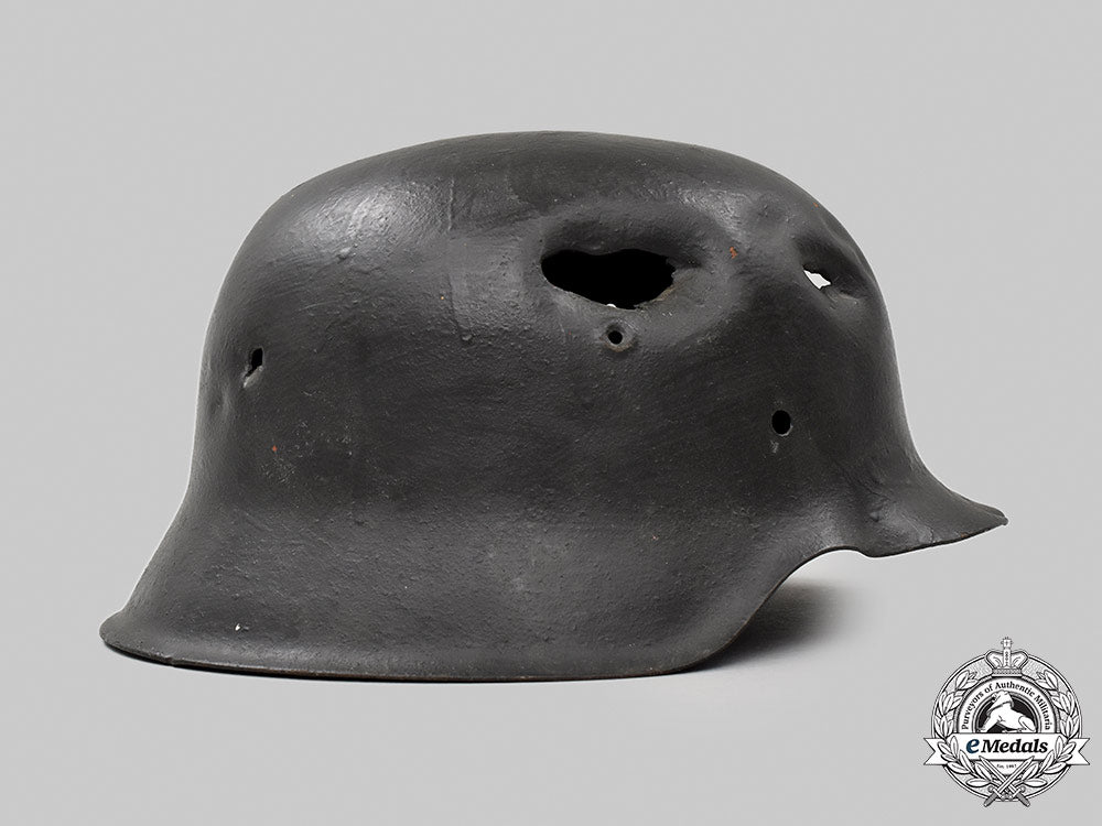 germany,_heer._a_battle-_damaged_m42_stahlhelm_051_m21_mnc9370-copy_1