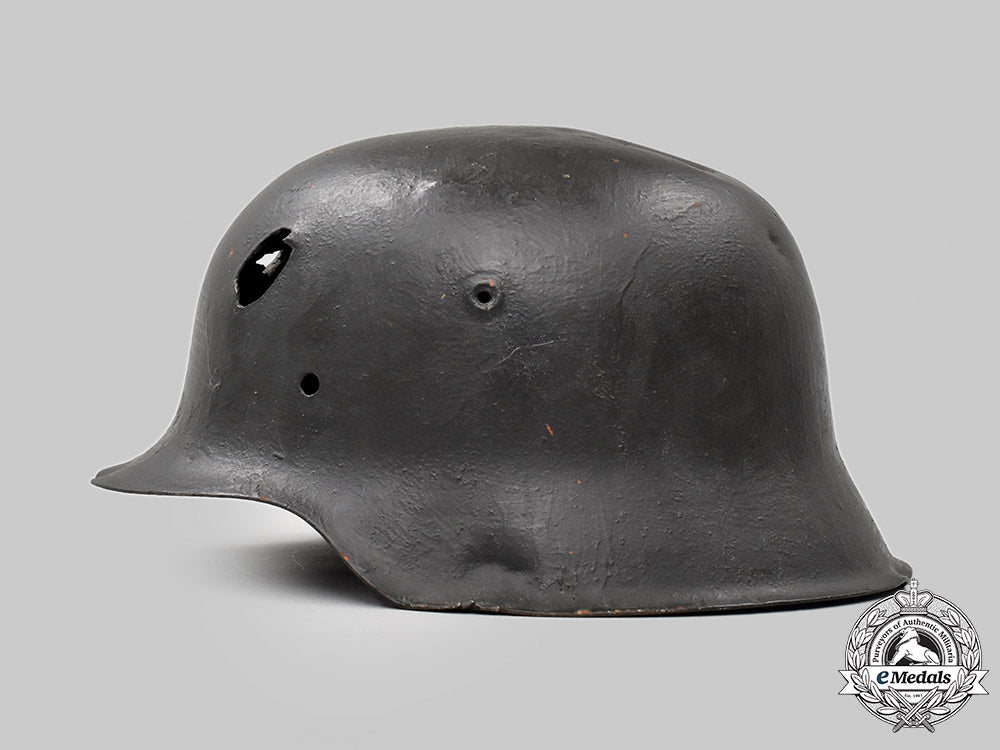 germany,_heer._a_battle-_damaged_m42_stahlhelm_053_m21_mnc9372-copy_1