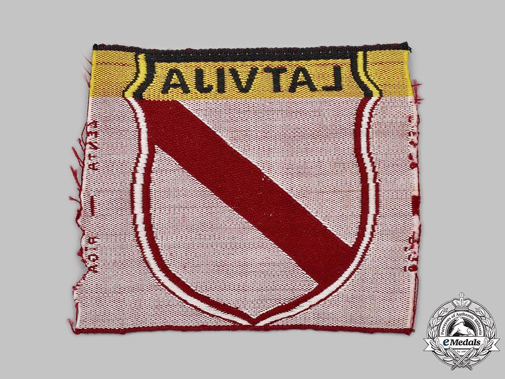 germany,_wehrmacht._a_latvian_volunteer’s_sleeve_shield,_by_lenta_47_m21_mnc1011