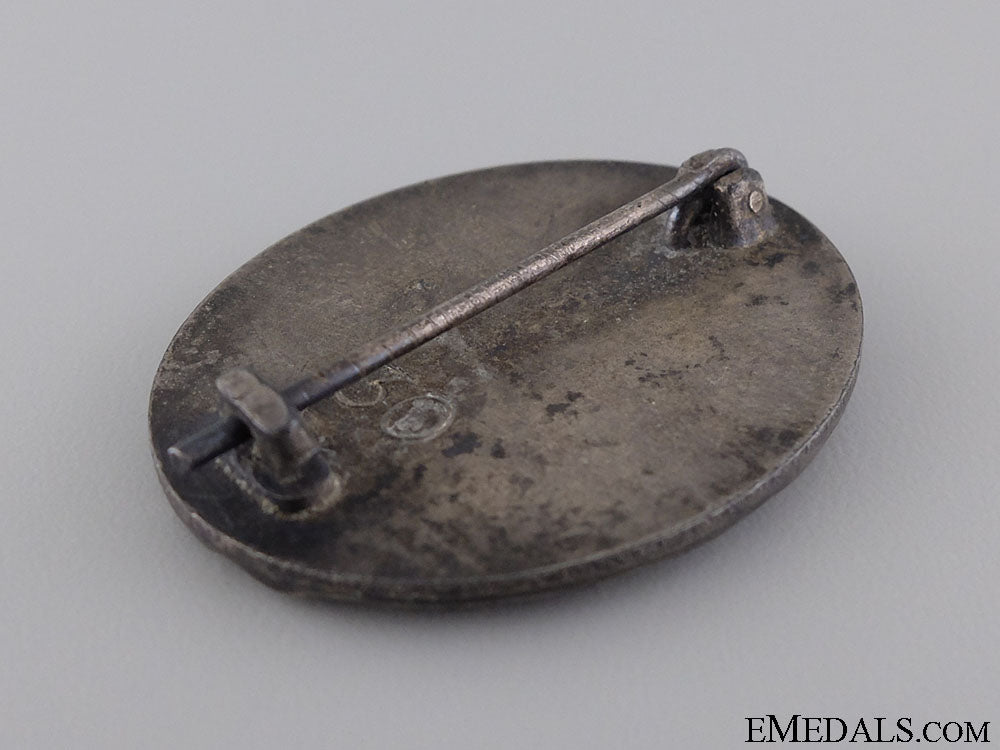 a_wwii_wound_badge;_silver_grade_by_hauptmünzamt_7.jpg543e9e4771f16