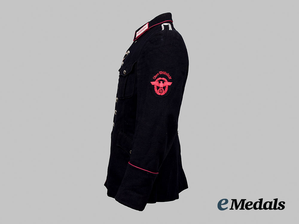 germany,_fire_protection_police._a_feuerschutzpolizei_feuerwehrmann_of_ober-_wöllstadt_service_tunic__a_i1_0111