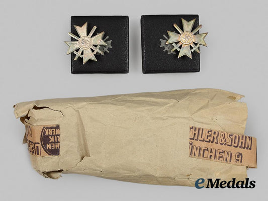 germany,_third_reich._two_unissued_war_merit_crosses_first_class_with_wrapping_paper__a_i1_0388