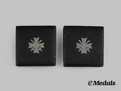 germany,_third_reich._two_unissued_war_merit_crosses_first_class_with_wrapping_paper__a_i1_0389