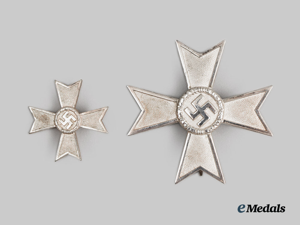 germany,_third_reich._a_cased_war_merit_cross_first_class_by_friedrich_orth_with_half-_miniature_by_wilhelm_deumer__a_i1_0660
