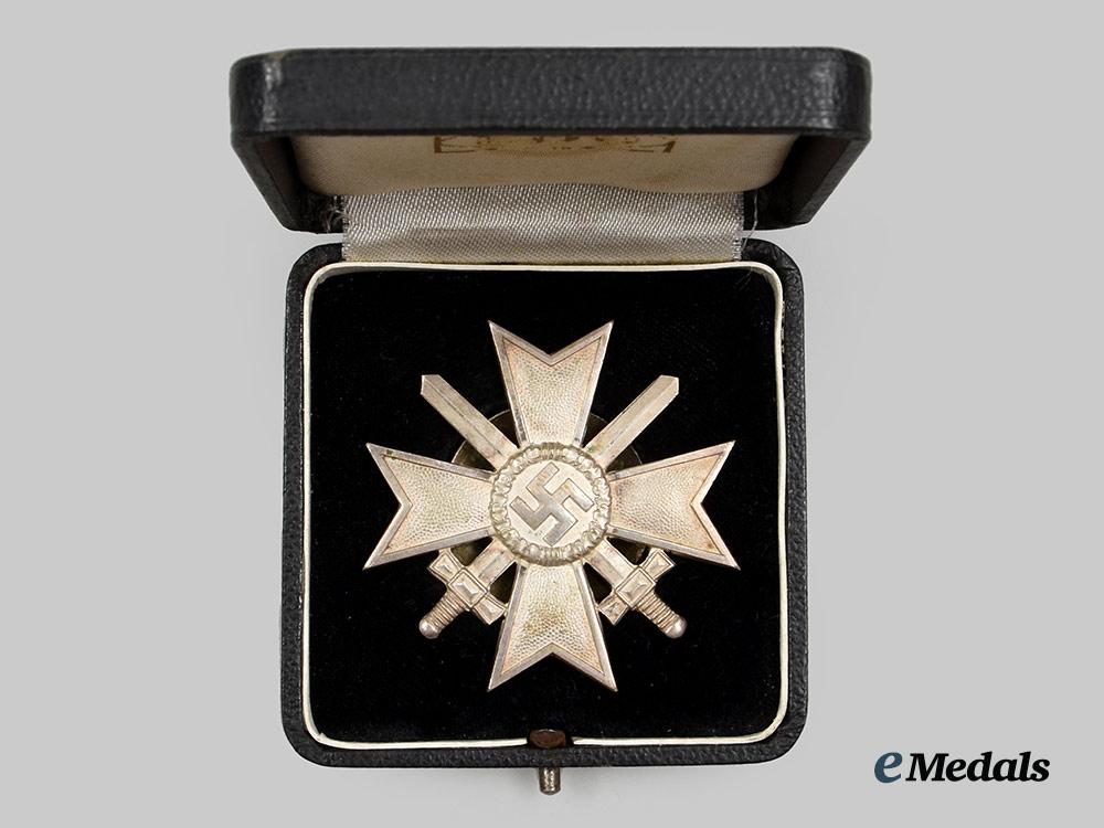 germany,_wehrmacht._a_war_merit_cross_i_class_with_swords_and_case,_screwback_version,_by_c._e._juncker__a_i1_1264