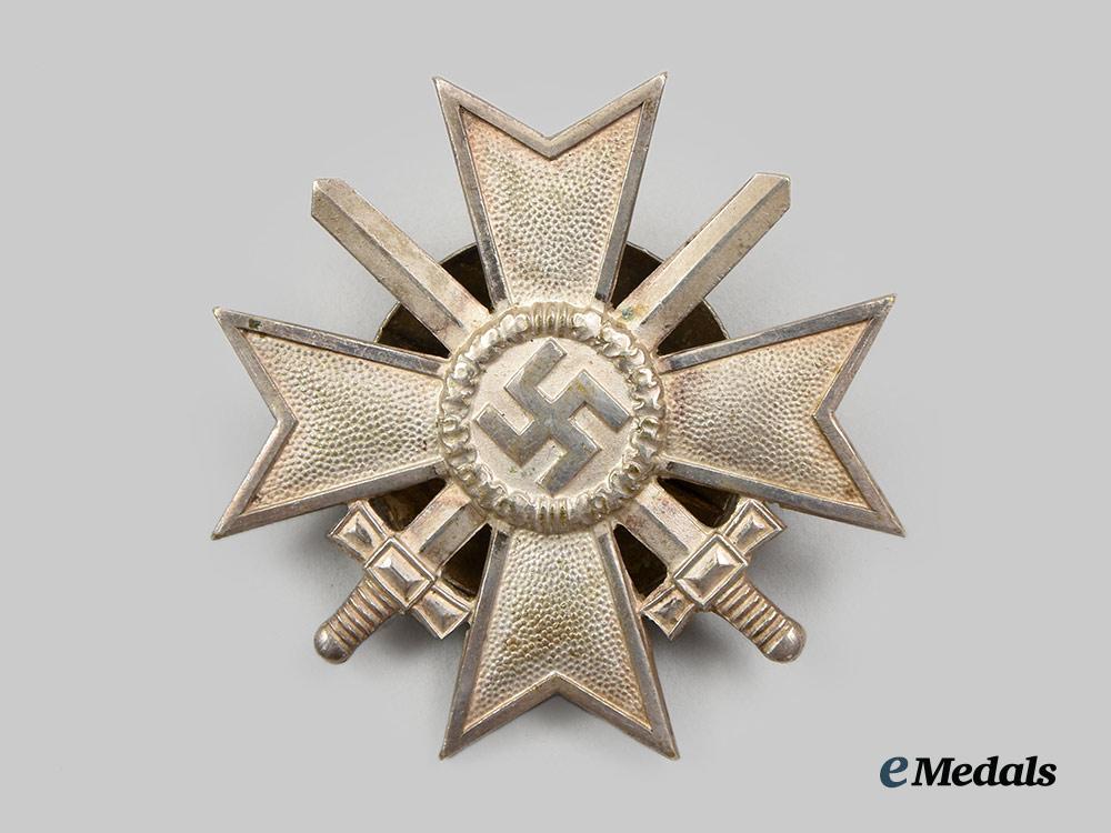 germany,_wehrmacht._a_war_merit_cross_i_class_with_swords_and_case,_screwback_version,_by_c._e._juncker__a_i1_1269