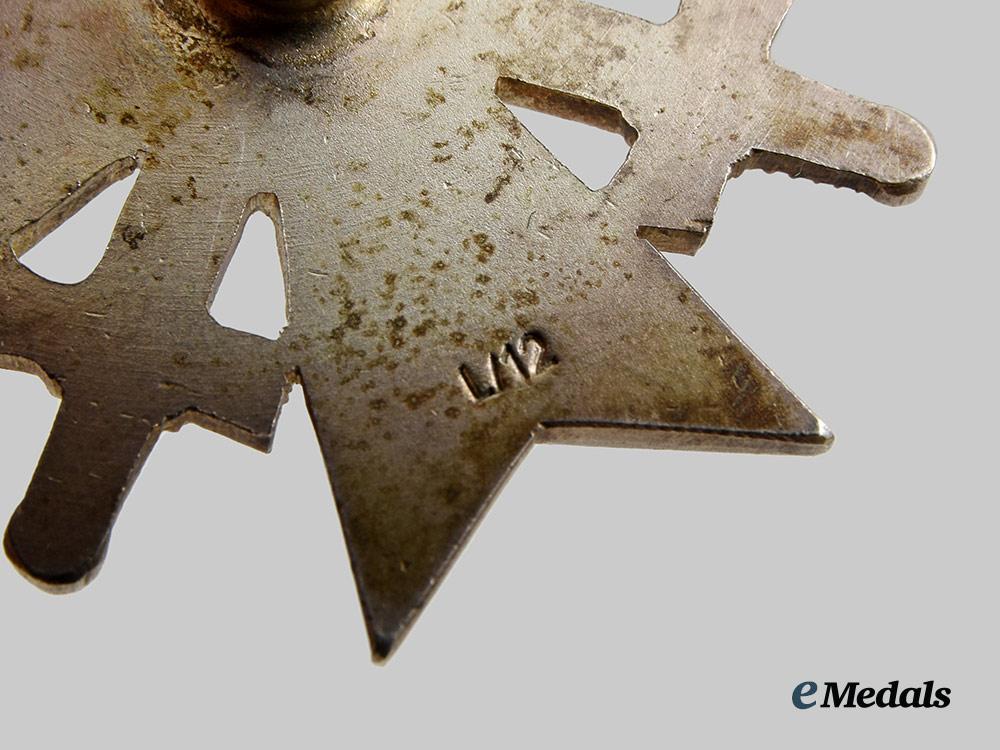 germany,_wehrmacht._a_war_merit_cross_i_class_with_swords_and_case,_screwback_version,_by_c._e._juncker__a_i1_1272
