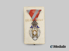 Serbia, Kingdom. A Cased Order of the White Eagle, V. Class, Type II, c. 1920 by Huguenin Freres & Co.