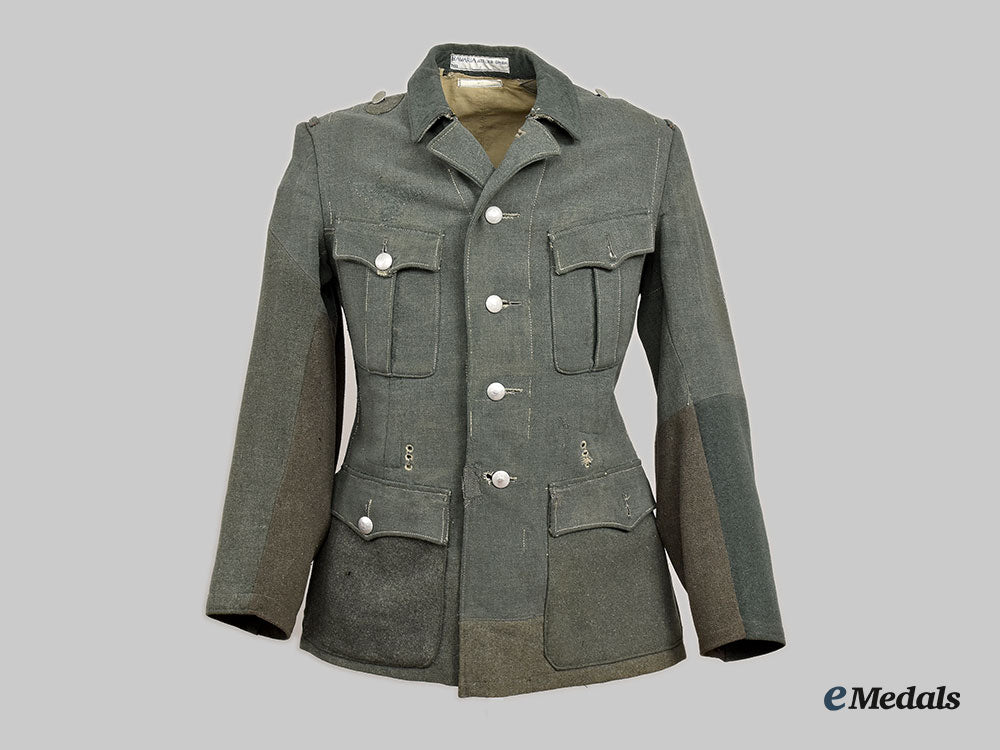 germany,_wehrmacht._a_late_war_de-_badged_uniform_tunic__l22__m_n_c0975_739